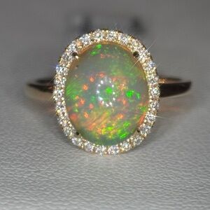 2.20ct Opal and Diamond Halo Ring in Gold